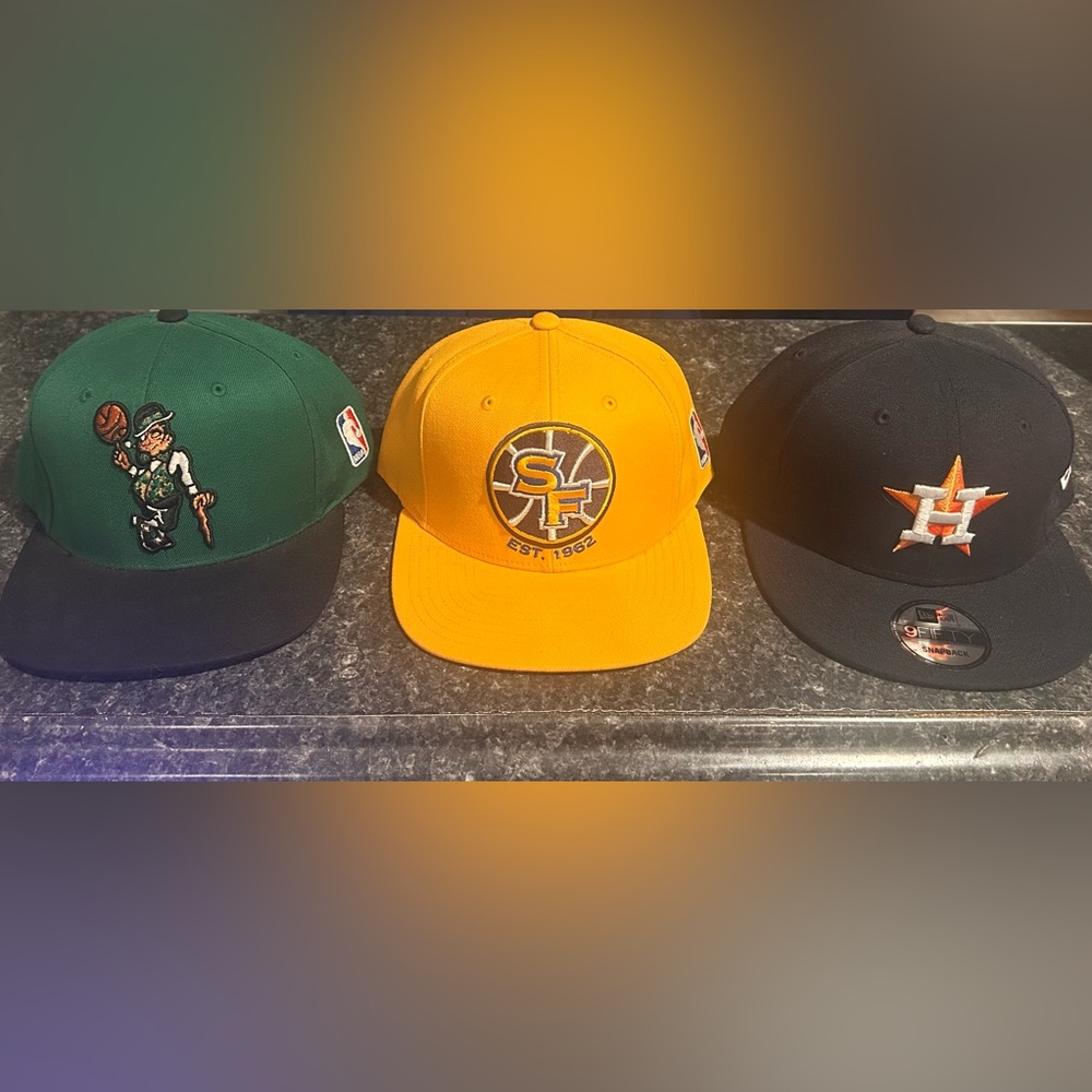 Mitchell & Ness  and one new era black and orange capYellow and Green Cap